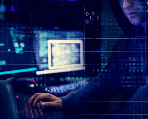 Hacker working using computer with codes Hacker working using computer with codes