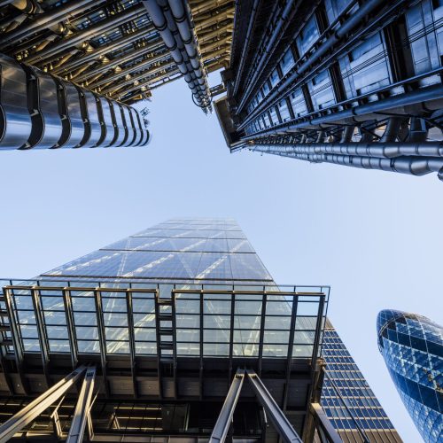 Low angle view of blue sky from122 Leadenhall St, The Cheesegrater and Gherkin, London, UK